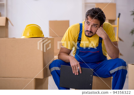 Young male contractor doing home relocation Young male contractor doing home relocation 94356322