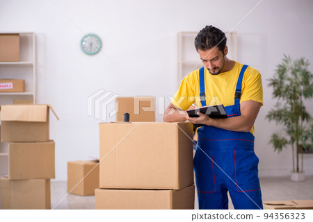 Young male contractor doing home relocation Young male contractor doing home relocation 94356323