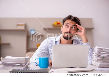 Young businessman employee working from home during pandemic 94356595
