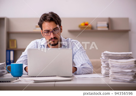 Young businessman employee working from home during pandemic Young businessman employee working from home during pandemic 94356596