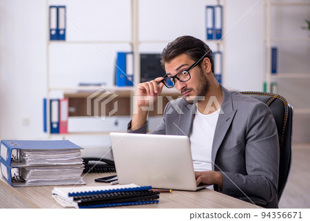 Young male employee working in the office 94356671