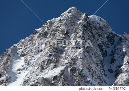 Central Alps, Senjojiki Cirque, Nagano Prefecture, Sagidal's head covered in fresh snow and climbers climbing Central Alps, Senjojiki Cirque, Nagano Prefecture, Sagidal's head covered in fresh snow and climbers climbing 94356792