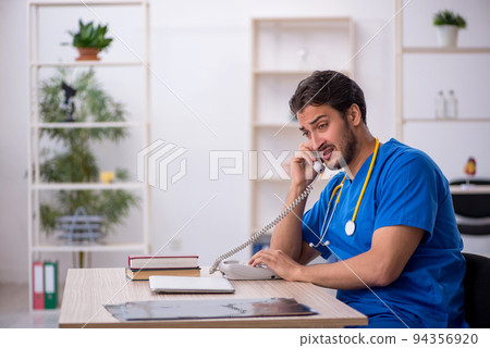Young male doctor in telemedicine concept Young male doctor in telemedicine concept 94356920