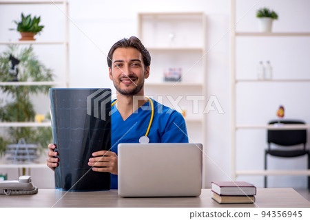 Young male doctor radiologist working in the clinic Young male doctor radiologist working in the clinic 94356945