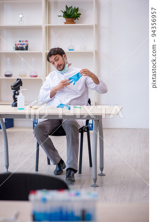 Young male chemist working at the lab Young male chemist working at the lab 94356957