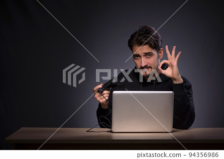 Young male gamer on grey background Young male gamer on grey background 94356986