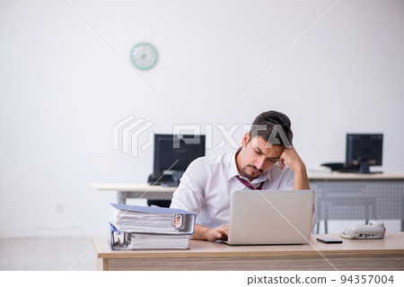 Young male employee working in the office 94357004