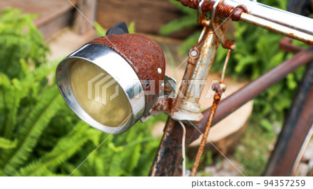 Rusty old and traditional bicycle head light Rusty old and traditional bicycle head light 94357259