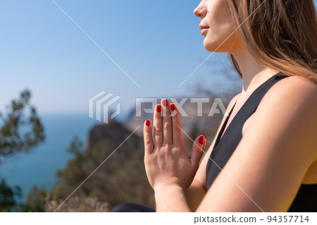 Young woman with long hair, fitness instructor in Sportswear Leggings and Tops, stretching before pilates, on a yoga mat near the sea on a sunny day, female fitness yoga routine concept Young woman with long hair, fitness instructor in Sportswear Leggings and Tops, stretching before pilates, on a yoga mat near the sea on a sunny day, female fitness yoga routine concept 94357714