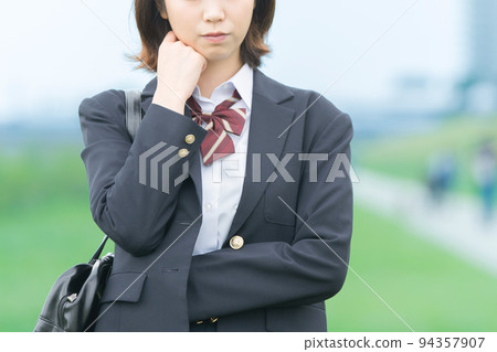 A high school girl giving a hand sign of refusal A high school girl giving a hand sign of refusal 94357907