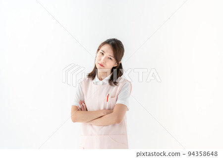 Worried woman, care worker, home helper, nursery teacher Worried woman, care worker, home helper, nursery teacher 94358648