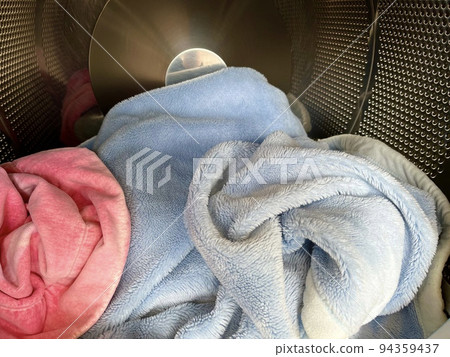 A blanket washed in a large washing machine 94359437