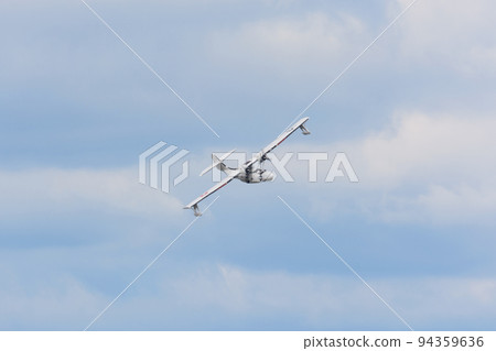 US Army Air Corps OA-10 Catalina flying boat above the clouds 94359636