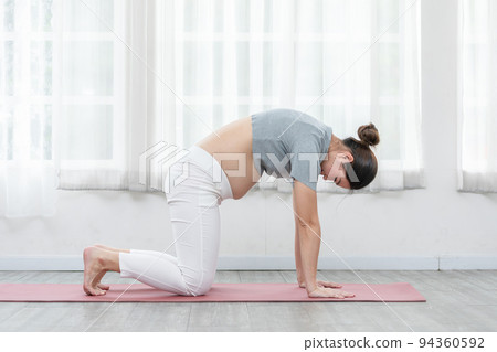 Happy Attractive Asian Pregnant woman practice Cat Cow Pose to meditation smile with big belly comfortable and relax,Pregnancy woman breathing and calm with yoga. Self Care Yoga Pregnant Concept Happy Attractive Asian Pregnant woman practice Cat Cow Pose to meditation smile with big belly comfortable and relax,Pregnancy woman breathing and calm with yoga. Self Care Yoga Pregnant Concept 94360592