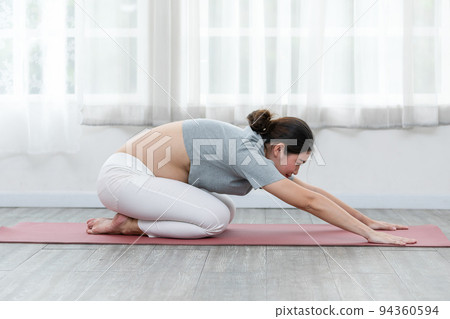 Happy Attractive Asian Pregnant woman practice Child Pose to meditation smile with big belly comfortable and relax,Pregnancy woman breathing and calm with yoga. Self Care Yoga Pregnant Concept Happy Attractive Asian Pregnant woman practice Child Pose to meditation smile with big belly comfortable and relax,Pregnancy woman breathing and calm with yoga. Self Care Yoga Pregnant Concept 94360594