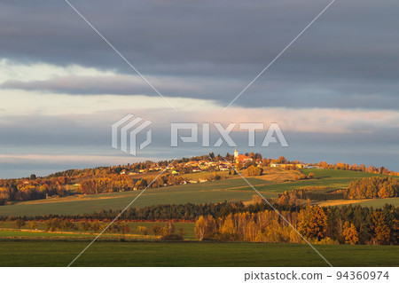 autumn landscape with a village on the hill autumn landscape with a village on the hill 94360974