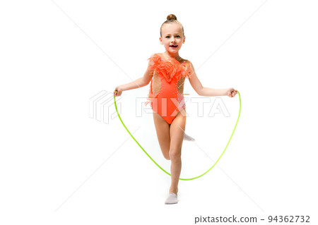 Sporty gymnast pretty child jump with rope Sporty gymnast pretty child jump with rope 94362732