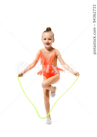Sporty gymnast pretty child jump with rope 94362733