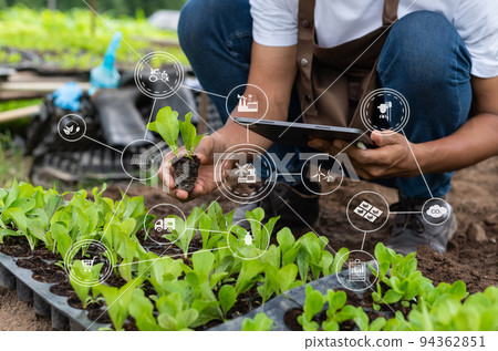 Agriculture technology farmer woman holding tablet or tablet technology to research about agriculture problems analysis data and visual icon.Smart farming Agriculture technology farmer woman holding tablet or tablet technology to research about agriculture problems analysis data and visual icon.Smart farming 94362851