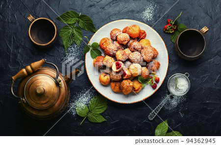 Curd donuts with raspberries for tea 94362945