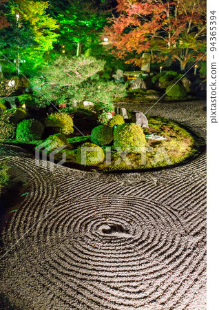 A dry landscape garden illuminated at Manshuin Monzeki at night in Kyoto 94365394