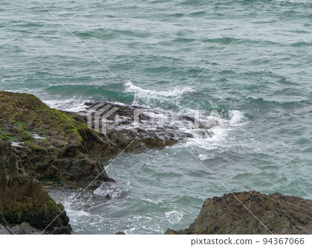 Wild rock formation beside of water. Ocean waves & Coastal Cliffs Wild rock formation beside of water. Ocean waves & Coastal Cliffs 94367066