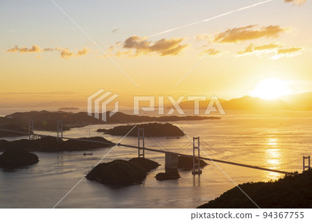 Scenery of Shimanami Kaido and Kurushima Kaikyo Bridge in the sunset seen from Mt. Scenery of Shimanami Kaido and Kurushima Kaikyo Bridge in the sunset seen from Mt. 94367755