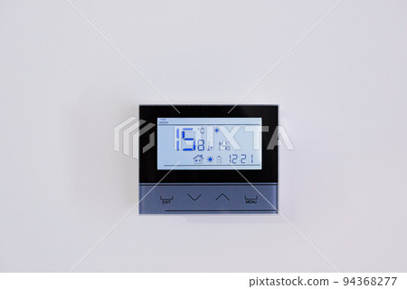 Control panel, air conditioning and heating system of the house, on a white wall, smart home Control panel, air conditioning and heating system of the house, on a white wall, smart home 94368277
