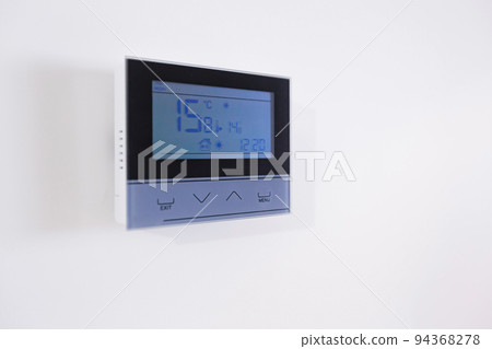 Control panel, air conditioning and heating system of the house, on a white wall, smart home Control panel, air conditioning and heating system of the house, on a white wall, smart home 94368278