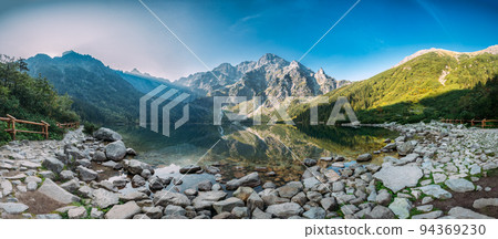 Tatra National Park, Poland. Panorama Famous Mountains Lake Morskie Oko Or Sea Eye Lake In Summer Morning. Five Lakes Valley. Beautiful Scenic Viev 94369230