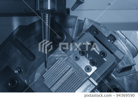 The 5-axis CNC milling machine cutting the metal mold part. The 5-axis CNC milling machine cutting the metal mold part. 94369590