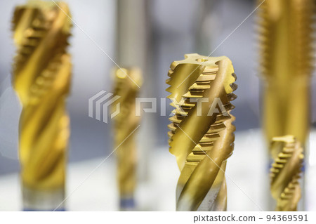 Close-up scene the special tapping tools for CNC milling machine. 94369591