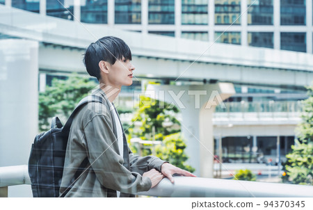 Office casual young businessman through the glass Office casual young businessman through the glass 94370345