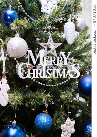 Christmas card with inscription Merry Christmass on christmas tree with toys Christmas card with inscription Merry Christmass on christmas tree with toys 94371010