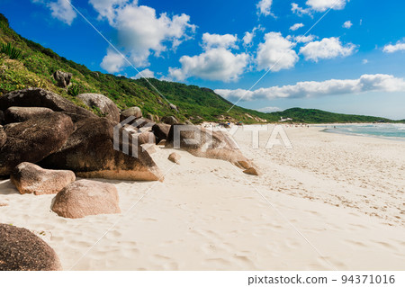 Praia da Galheta beach with rocks and ocean. Holiday banner from Brazil Praia da Galheta beach with rocks and ocean. Holiday banner from Brazil 94371016