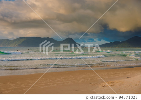 Morro das Pedras beach and ocean with waves at sunrise 94371023