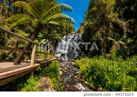 Popular touristic waterfall with tropical plants Popular touristic waterfall with tropical plants 94371025