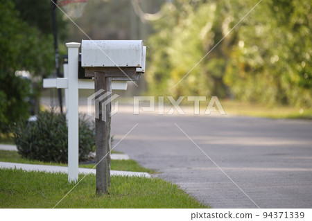 Typical american outdoors mail box on suburban street side 94371339