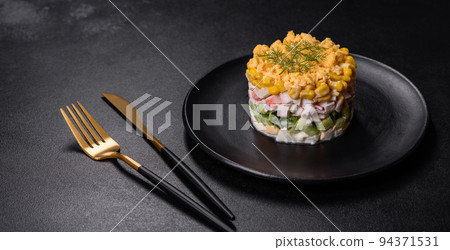 Fresh vegetable salad with corn, pepper, crab, cucumber, eggs and mayonnaise 94371531