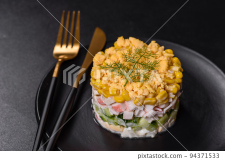 Fresh vegetable salad with corn, pepper, crab, cucumber, eggs and mayonnaise 94371533