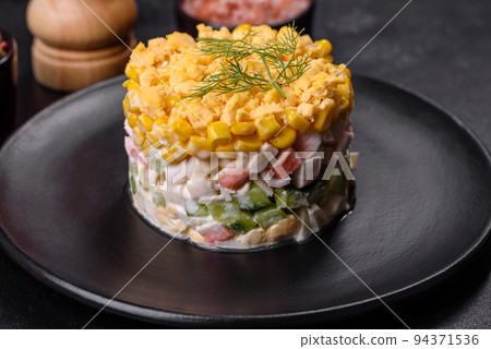 Fresh vegetable salad with corn, pepper, crab, cucumber, eggs and mayonnaise Fresh vegetable salad with corn, pepper, crab, cucumber, eggs and mayonnaise 94371536