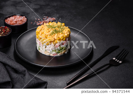 Fresh vegetable salad with corn, pepper, crab, cucumber, eggs and mayonnaise Fresh vegetable salad with corn, pepper, crab, cucumber, eggs and mayonnaise 94371544