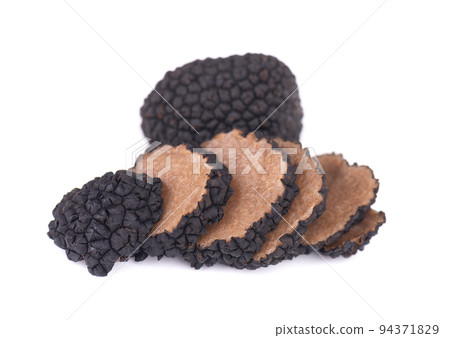 Black truffles isolated on a white background. Fresh sliced truffle. Delicacy exclusive truffle mushroom. Piquant and fragrant French delicacy. Clipping path. 94371829