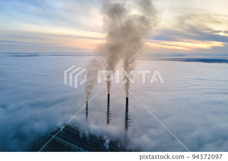 Coal power plant high pipes with black smoke moving upwards polluting atmosphere. Production of electrical energy with fossil fuel concept Coal power plant high pipes with black smoke moving upwards polluting atmosphere. Production of electrical energy with fossil fuel concept 94372097