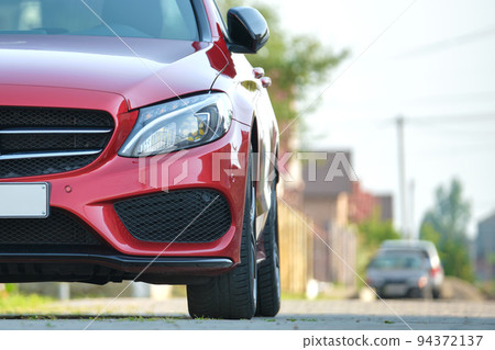 Close up of a car parked on city street side. Urban traffic concept 94372137