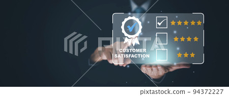 Quality assurance of business services, Businessman Hand shows the sign of the top service Quality assurance in Black background , Guarantee, Standards, ISO certification and standardization concept. 94372227