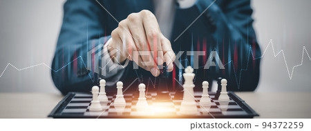 Business strategy competitive ideas concept, Chess game on chess board behind business background. Business present financial and marketing strategy analysis. Investment target in global economy . 94372259