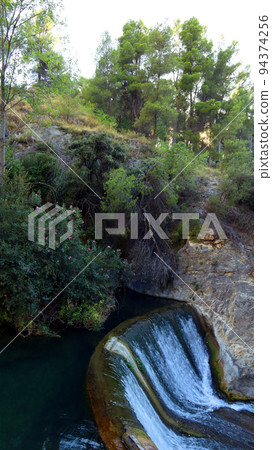 Beautiful unique landscape, mountain river, bay waterfall among the rocks, natural pools, SPA, Ontinyent, Spain Beautiful unique landscape, mountain river, bay waterfall among the rocks, natural pools, SPA, Ontinyent, Spain 94374256