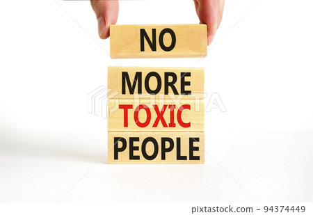No more toxic people symbol. Concept words No more toxic people on wooden blocks on a beautiful white table white background. Psychologist hand. Business, psychological no more toxic people concept. 94374449