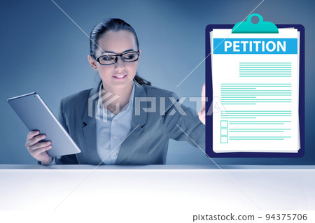 Businesswoman in petition application concept Businesswoman in petition application concept 94375706